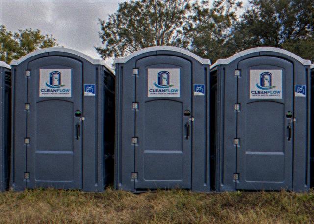 ADA accessible portable restrooms with wheelchair signage on the door